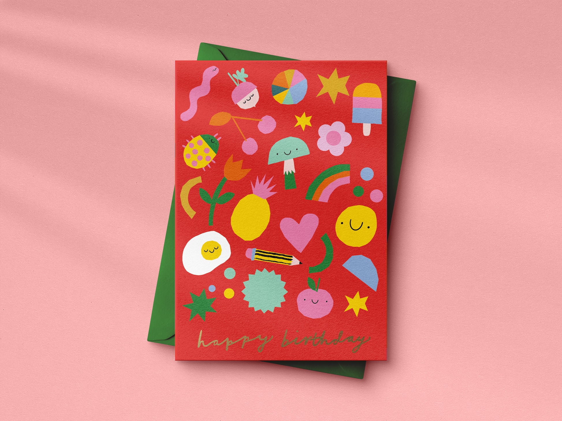 Red birthday card with colorful illustrations on a pink background
